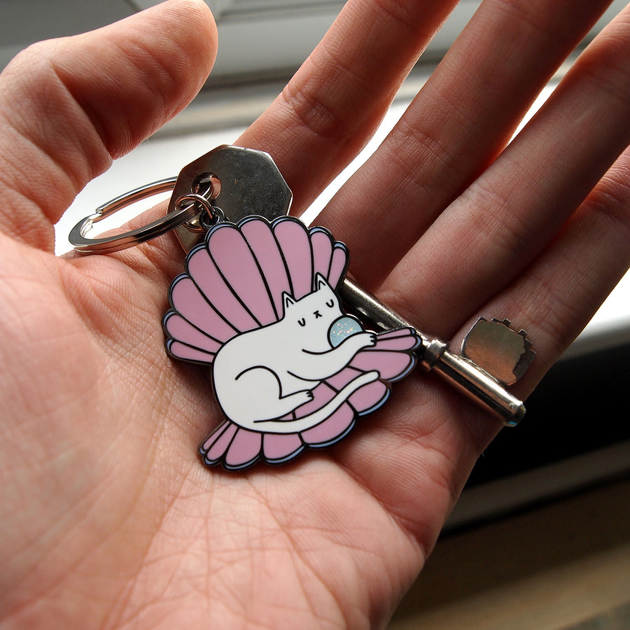 Clamshell Kitty Glitter Keyring by Merpola & I Like CATS  in hand
